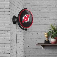 Load image into Gallery viewer, New Jersey Devils: Original Oval Rotating Lighted Wall Sign - The Fan-Brand