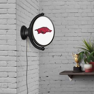 Arkansas Razorbacks: Original Oval Rotating Lighted Wall Sign - The Fan-Brand