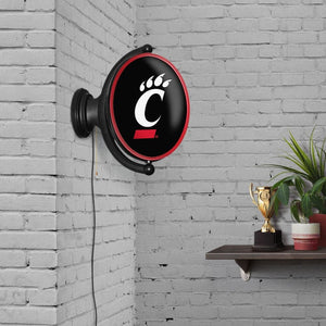 Cincinnati Bearcats: Original Oval Rotating Lighted Wall Sign - The Fan-Brand