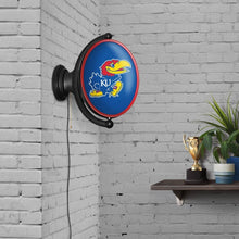 Load image into Gallery viewer, Kansas Jayhawks: Original Oval Rotating Lighted Wall Sign - The Fan-Brand