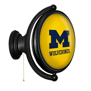 Michigan Wolverines: Maize - Original Oval Rotating Lighted Wall Sign - The Fan-Brand