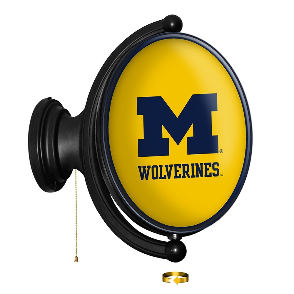 Michigan Wolverines: Maize - Original Oval Rotating Lighted Wall Sign - The Fan-Brand