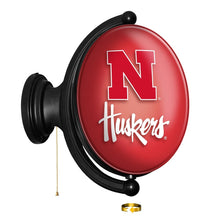 Load image into Gallery viewer, Nebraska Cornhuskers: Original Oval Rotating Lighted Wall Sign - The Fan-Brand