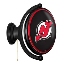 Load image into Gallery viewer, New Jersey Devils: Original Oval Rotating Lighted Wall Sign - The Fan-Brand