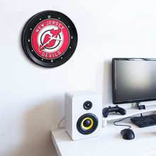 Load image into Gallery viewer, New Jersey Devils: Ribbed Frame Wall Clock - The Fan-Brand