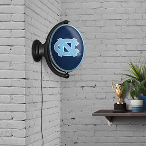 North Carolina Tar Heels: Original Oval Rotating Lighted Wall Sign - The Fan-Brand