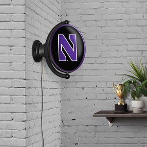 Northwestern Wildcats: Original Oval Rotating Lighted Wall Sign - The Fan-Brand