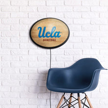 Load image into Gallery viewer, UCLA Bruins: Hardwood - Oval Slimline Lighted Wall Sign - The Fan-Brand