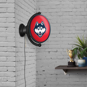 UConn Huskies: Original Oval Rotating Lighted Wall Sign - The Fan-Brand