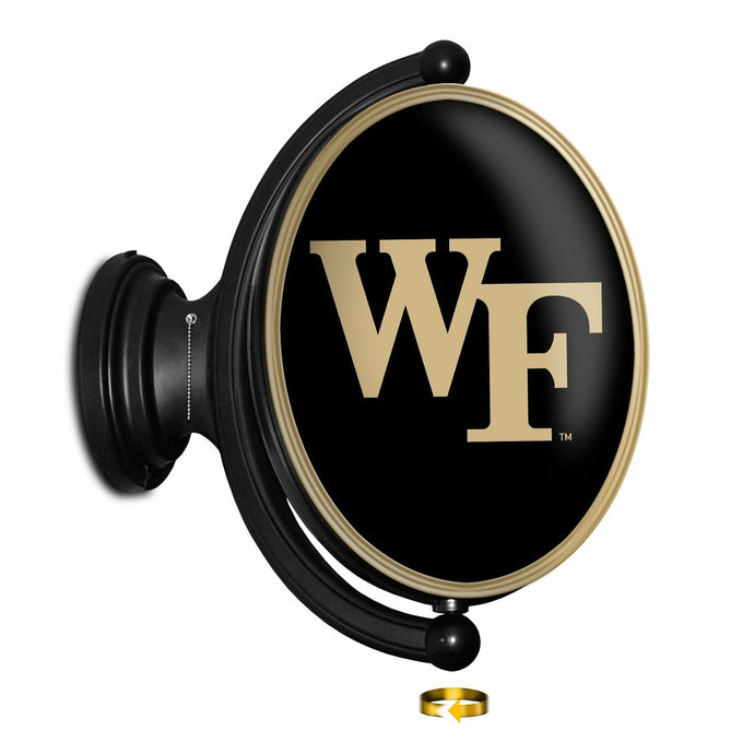 Wake Forest Demon Deacons: Original Oval Rotating Lighted Wall Sign - The Fan-Brand