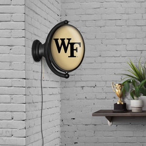 Wake Forest Demon Deacons: Original Oval Rotating Lighted Wall Sign - The Fan-Brand