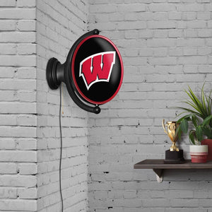 Wisconsin Badgers: Original Oval Rotating Lighted Wall Sign - The Fan-Brand